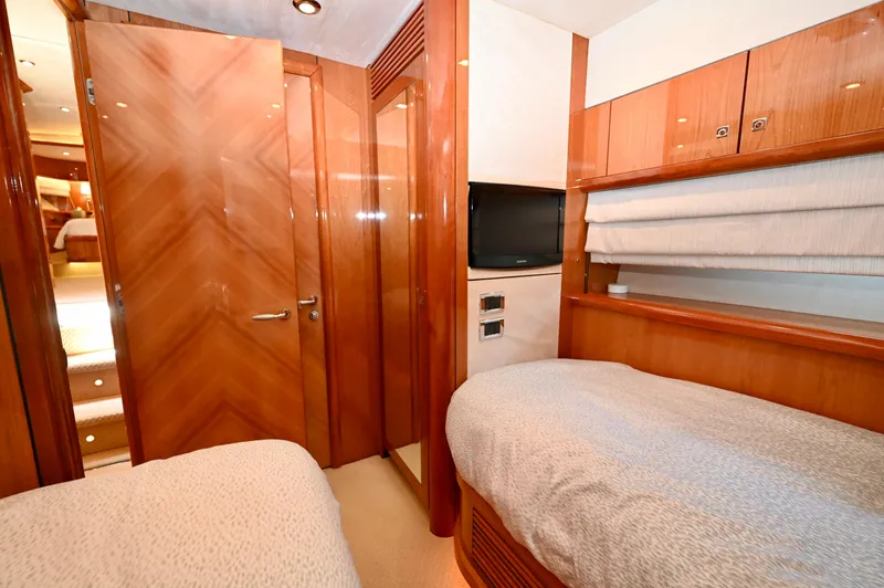 Slide: The Image of Luxurious cabin interior of 2005 Sunseeker 82 Yacht with twin beds and wood finish. - 33
