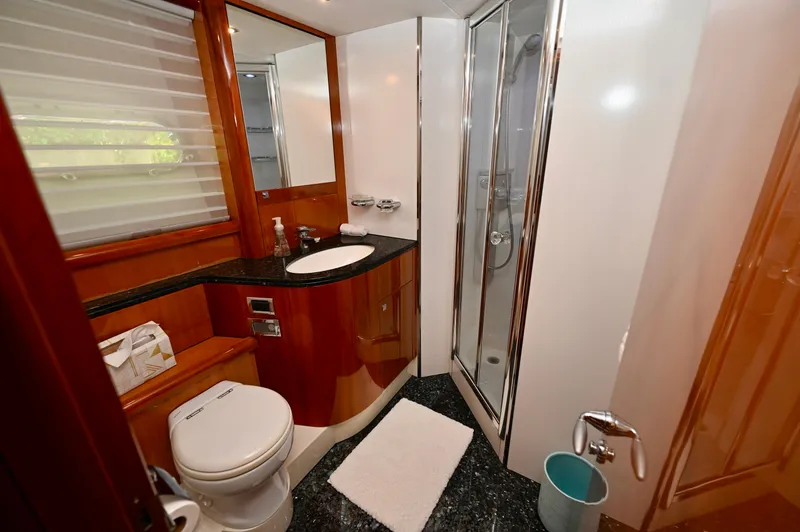 Slide: The Image of Luxurious bathroom in a 2005 Sunseeker 82 Yacht with modern fixtures and elegant design. - 39
