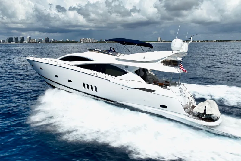 Slide: The Image of 2005 Sunseeker 82 Yacht cruising on open water under cloudy skies. - 4