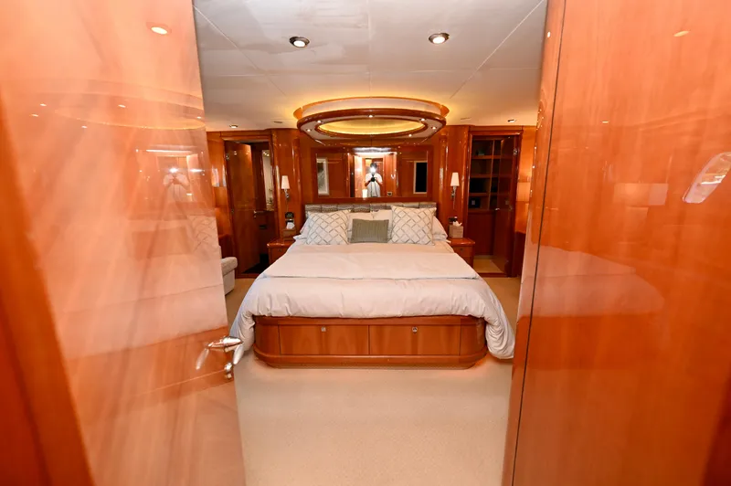 Slide: The Image of Luxurious bedroom interior of a 2005 Sunseeker 82 Yacht with elegant wood finishes. - 41