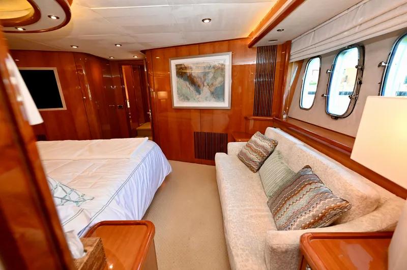 Slide: The Image of Luxurious interior of 2005 Sunseeker 82 Yacht with elegant wood paneling and cozy seating. - 44