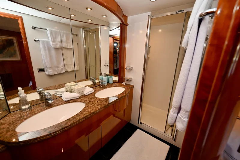 Slide: The Image of Luxurious bathroom in a 2005 Sunseeker 82 Yacht with dual sinks and elegant finishes. - 45
