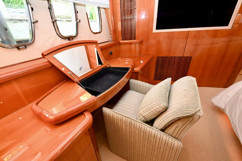 Slide: The Image of Luxurious interior of 2005 Sunseeker 82 Yacht with elegant wood finish and vanity area. - 48