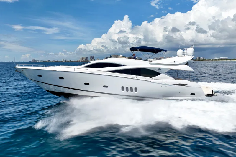 Slide: The Image of 2005 Sunseeker 82 Yacht cruising on open water under a partly cloudy sky. - 5
