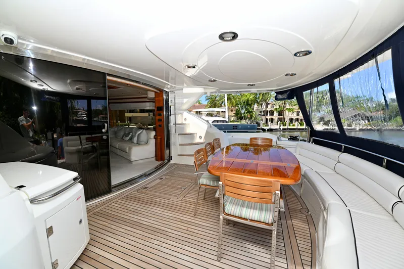 Slide: The Image of Luxurious 2005 Sunseeker 82 Yacht with elegant outdoor seating and dining area. - 6