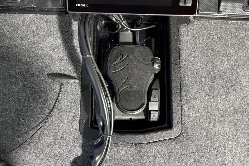 Slide: The Image of 2026 Phoenix 20 XE boat foot pedal and control panel on carpeted floor. - 10