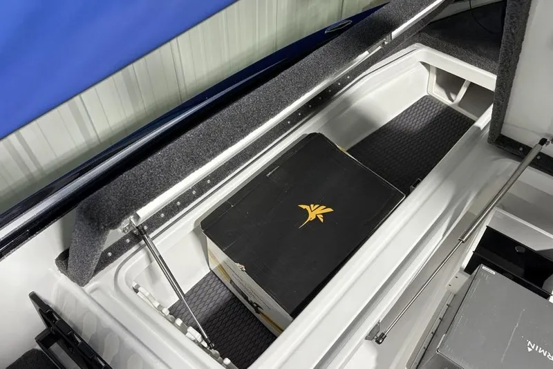 Slide: The Image of Storage compartment of 2026 Phoenix 20 XE boat with a black box inside. - 13