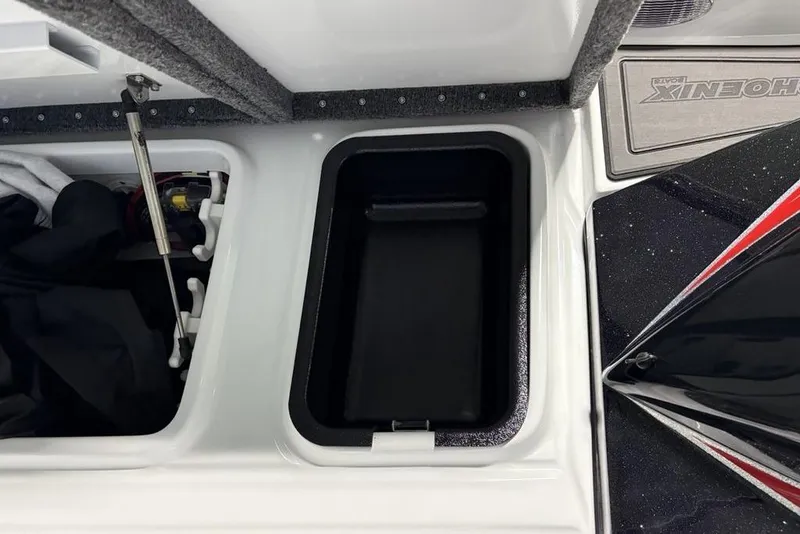 Slide: The Image of 2026 Phoenix 20 XE boat storage compartments with open lids and visible interior details. - 21
