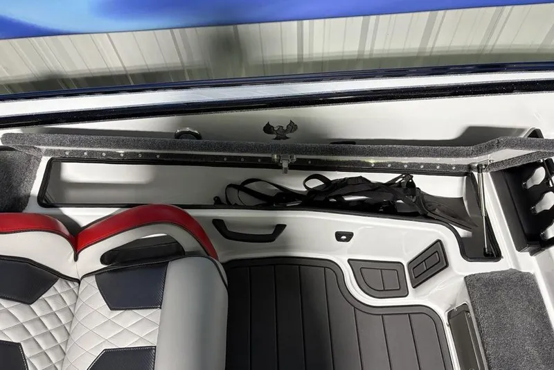 Slide: The Image of Interior of 2026 Phoenix 20 XE boat with storage compartment and seating. - 22
