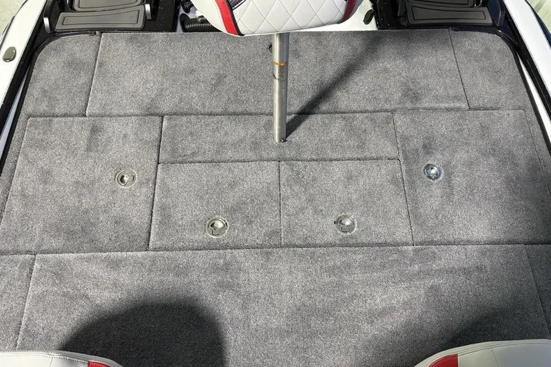 Slide: The Image of 2026 Phoenix 20 XE boat deck with gray carpet and seat post. - 24