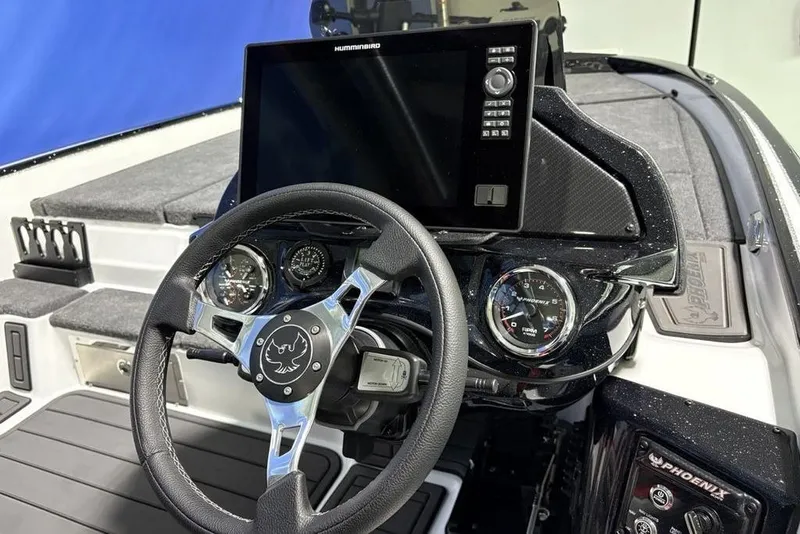 Slide: The Image of Steering console of 2026 Phoenix 20 XE boat with advanced navigation system. - 28