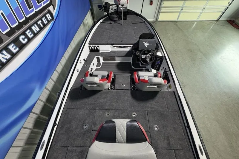 Slide: The Image of 2026 Phoenix 20 XE boat interior with modern seating and steering console. - 30