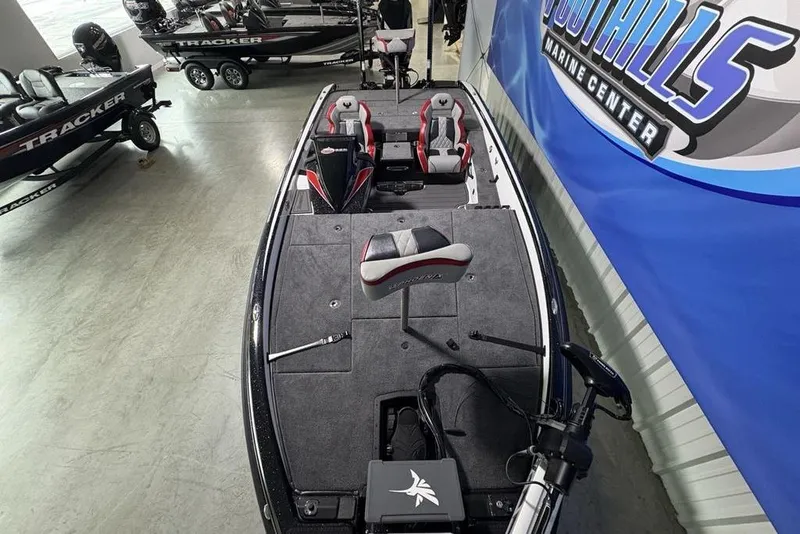 Slide: The Image of 2026 Phoenix 20 XE boat displayed at Foothills Marine Center showroom. - 35