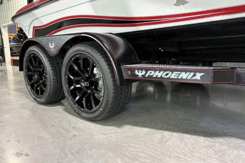 Slide: The Image of 2026 Phoenix 20 XE boat trailer with black wheels and red accents. - 4