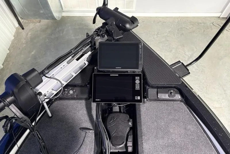 Slide: The Image of 2026 Phoenix 20 XE boat dashboard with dual Garmin displays and trolling motor. - 5