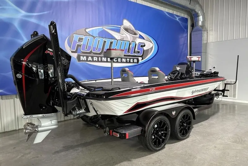 Slide: The Image of 2026 Phoenix 20 XE boat at Foothills Marine Center, featuring sleek design and powerful engine. - 7