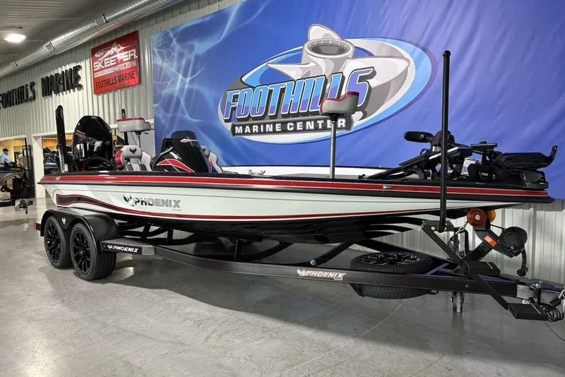 Slide: The Image of 2026 Phoenix 20 XE boat displayed at Foothills Marine Center showroom. - 8