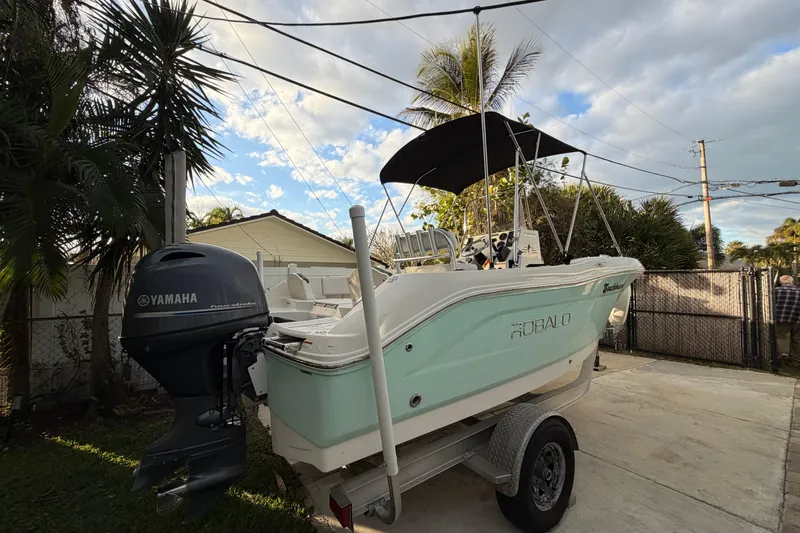 Slide: The Image of 2018 Robalo R180 Center Console boat with Yamaha engine on trailer. - 3