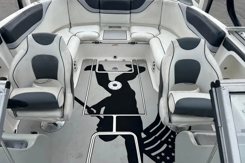 Slide: The Image of 2006 Yamaha Boats SX230 HO interior with stylish seating and unique floor design. - 13