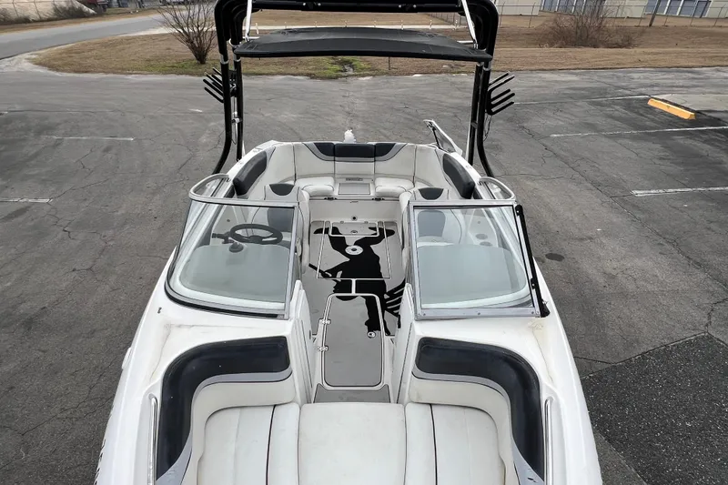 Slide: The Image of 2006 Yamaha Boats SX230 HO interior view with seating and steering wheel. - 14