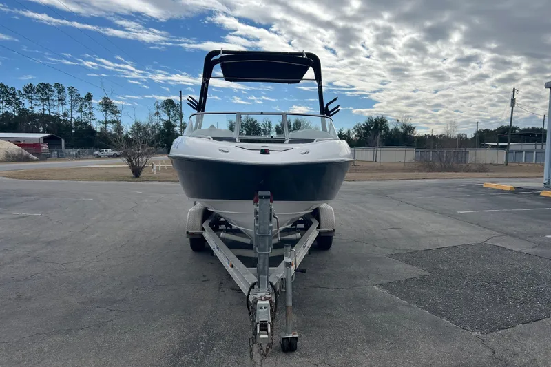 Slide: The Image of 2006 Yamaha Boats SX230 HO on trailer under cloudy sky. - 3