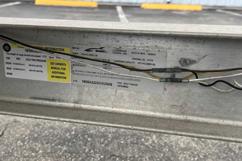 Slide: The Image of Label on a Yamaha Boats SX230 HO trailer, detailing specifications and tire pressure. - 39