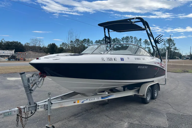 Slide: The Image of 2006 Yamaha Boats SX230 HO on trailer, parked outdoors under blue sky. - 4