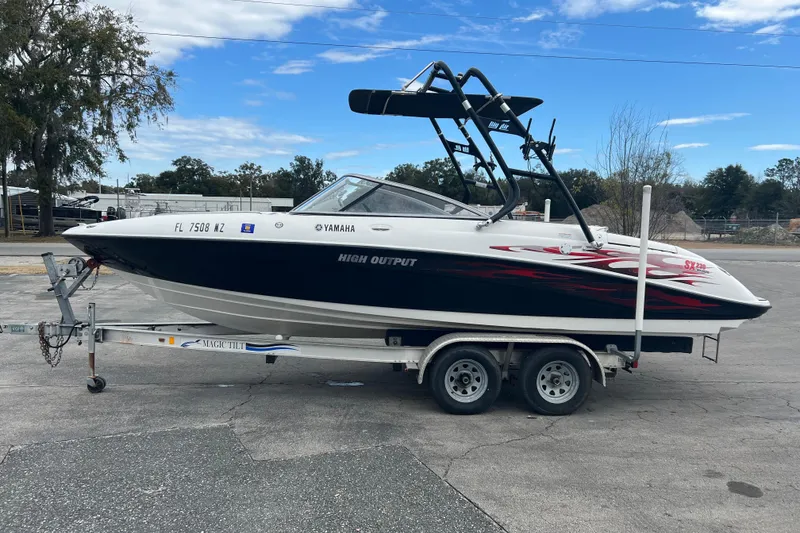 Slide: The Image of 2006 Yamaha Boats SX230 HO on trailer, parked outdoors, featuring sleek design and high output. - 5