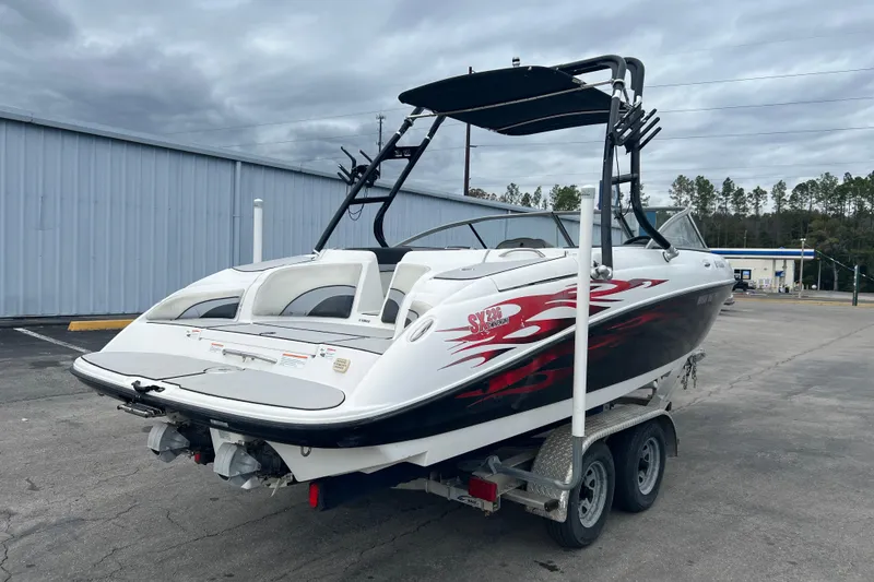 Slide: The Image of 2006 Yamaha Boats SX230 HO on trailer, featuring sleek design and vibrant graphics. - 8