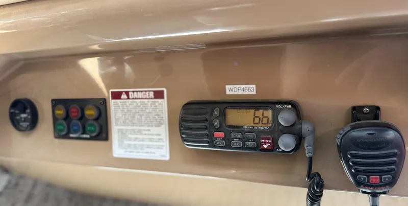 Slide: The Image of Control panel of a 2000 Carver 450 Voyager Pilothouse with radio and warning label. - 15