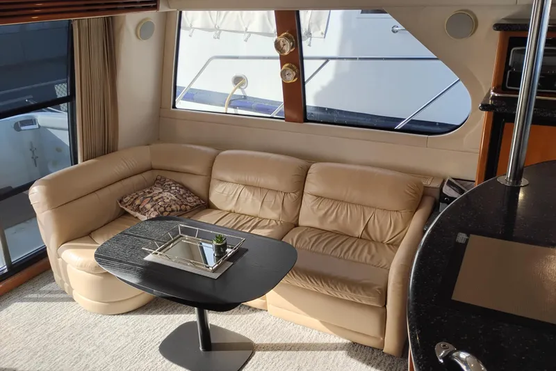 Slide: The Image of Luxurious interior of 2000 Carver 450 Voyager Pilothouse with leather seating and modern decor. - 18
