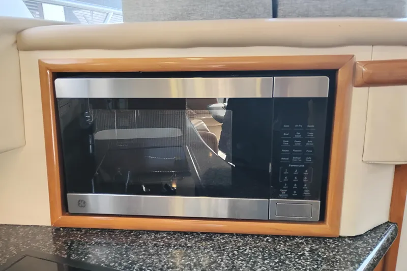 Slide: The Image of Built-in microwave in 2000 Carver 450 Voyager Pilothouse kitchen area. - 25