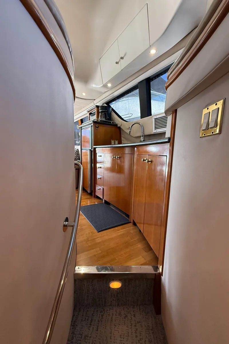 Slide: The Image of Interior view of 2000 Carver 450 Voyager Pilothouse with wooden cabinetry and modern design. - 26