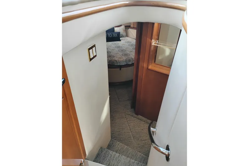 Slide: The Image of Stairway leading to bedroom in 2000 Carver 450 Voyager Pilothouse yacht interior. - 27
