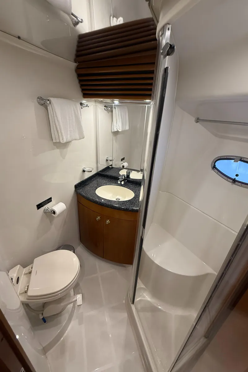 Slide: The Image of Bathroom interior of 2000 Carver 450 Voyager Pilothouse with shower, sink, and toilet. - 31
