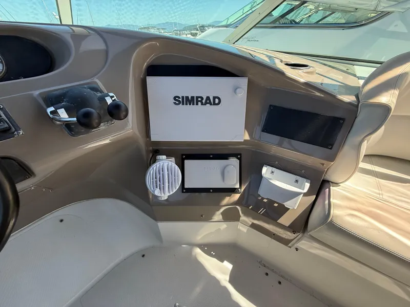 Slide: The Image of Control panel of 2000 Carver 450 Voyager Pilothouse with Simrad navigation system. - 35