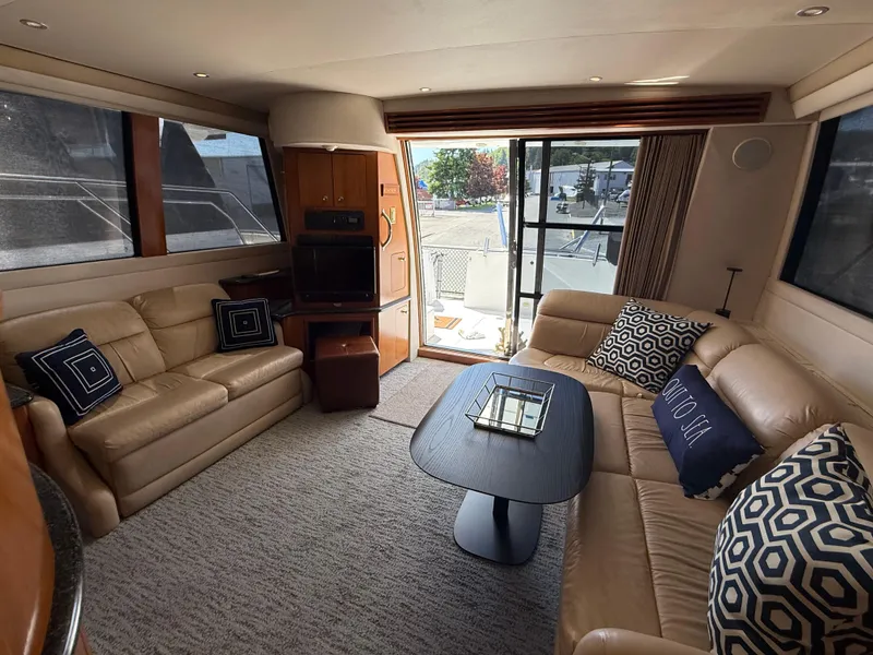 Slide: The Image of Luxurious interior of 2000 Carver 450 Voyager Pilothouse with leather seating and modern decor. - 5