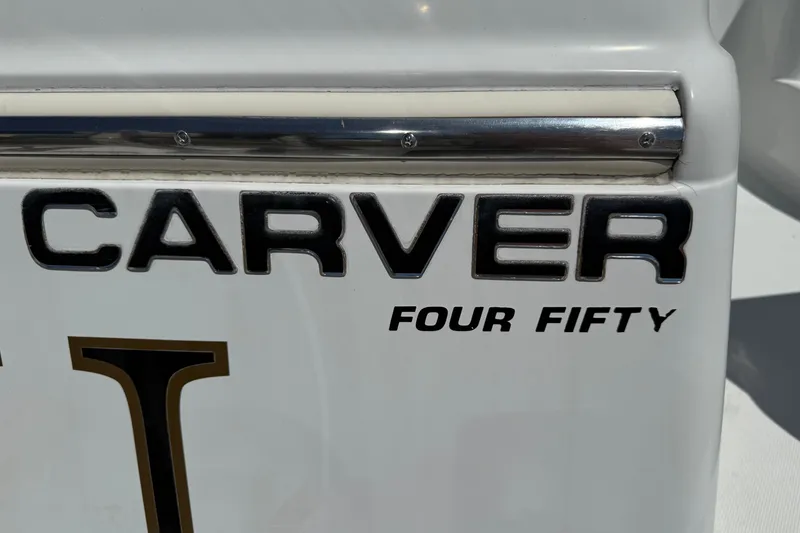 Slide: The Image of Carver 450 Voyager Pilothouse 2000 boat nameplate with "Four Fifty" text. - 51