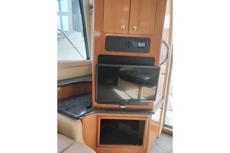 Slide: The Image of Interior of 2000 Carver 450 Voyager Pilothouse with TV and audio system. - 8