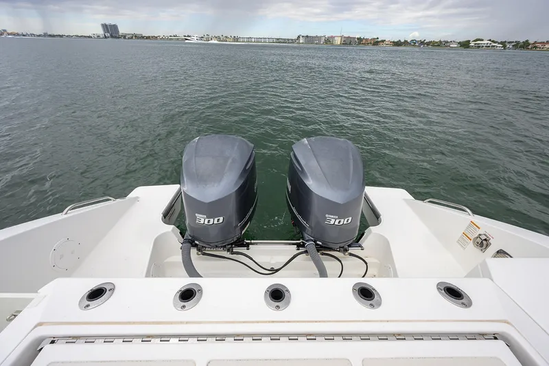 Slide: The Image of 2019 Pursuit S 328 Sport boat with dual Yamaha 300 engines on open water. - 47