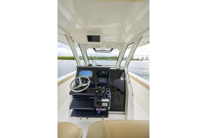 Slide: The Image of 2019 Pursuit S 328 Sport boat cockpit with modern navigation system. - 53