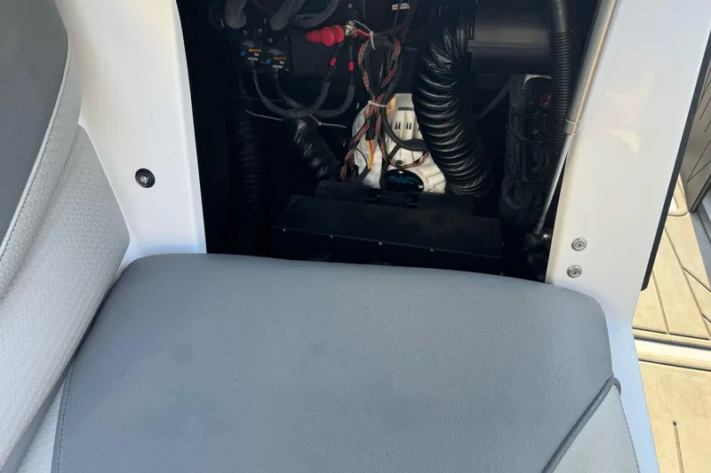Slide: The Image of Interior view of a 2021 Centurion Fi23 boat showing wiring and seating. - 17