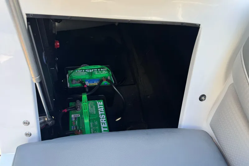 Slide: The Image of 2021 Centurion Fi23 boat battery compartment with Interstate batteries visible. - 18