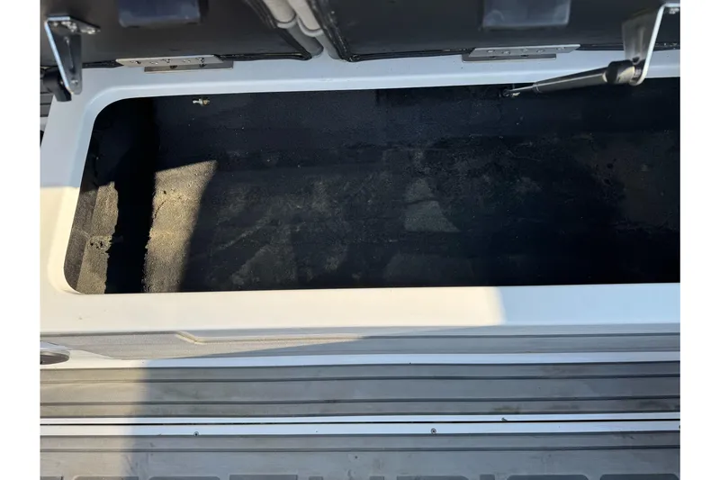 Slide: The Image of Open storage compartment in 2021 Centurion Fi23 boat. - 23