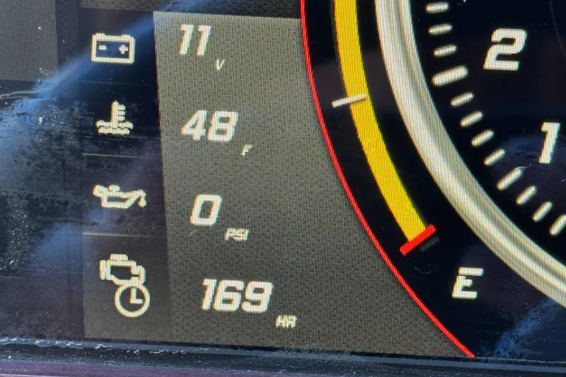 Slide: The Image of Dashboard display of a 2021 Centurion Fi23 showing battery, temperature, and engine hours. - 28