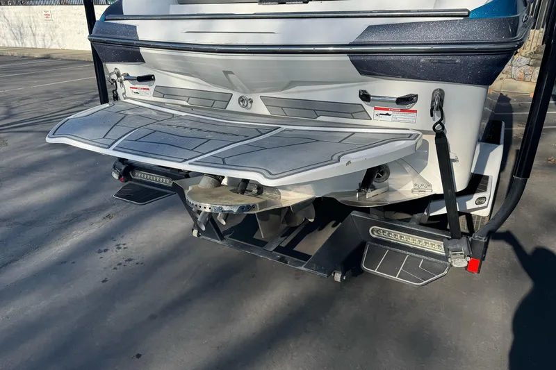 Slide: The Image of 2021 Centurion Fi23 boat rear view with swim platform and propeller. - 4