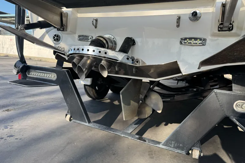 Slide: The Image of Rear view of 2021 Centurion Fi23 boat showing propeller and exhaust system. - 5
