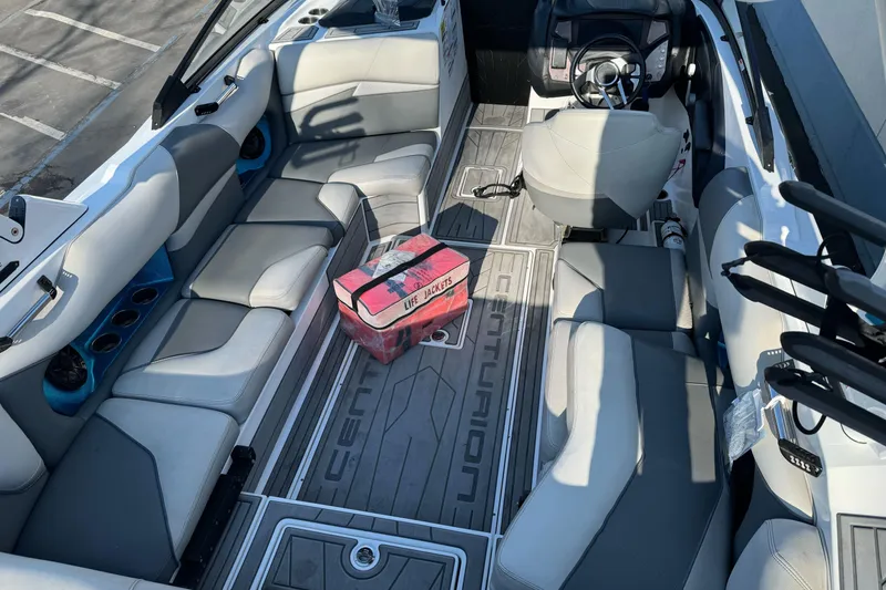 Slide: The Image of 2021 Centurion Fi23 boat interior with seating and life jacket on the floor. - 6