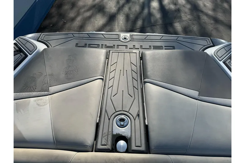 Slide: The Image of 2021 Centurion Fi23 boat interior with sleek gray seating and modern design. - 8