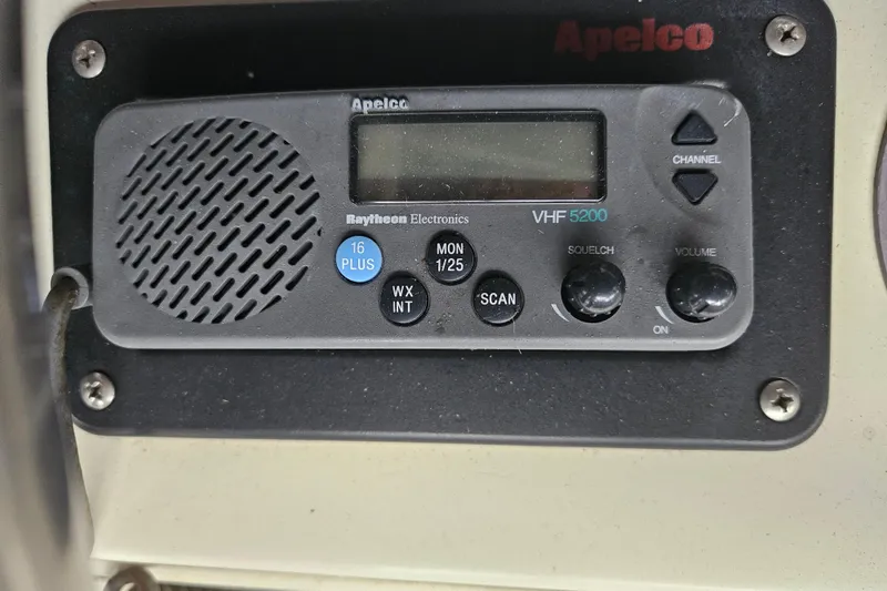 Slide: The Image of 1989 Tollycraft Sport Sedan dashboard with various gauges and dials. - 10